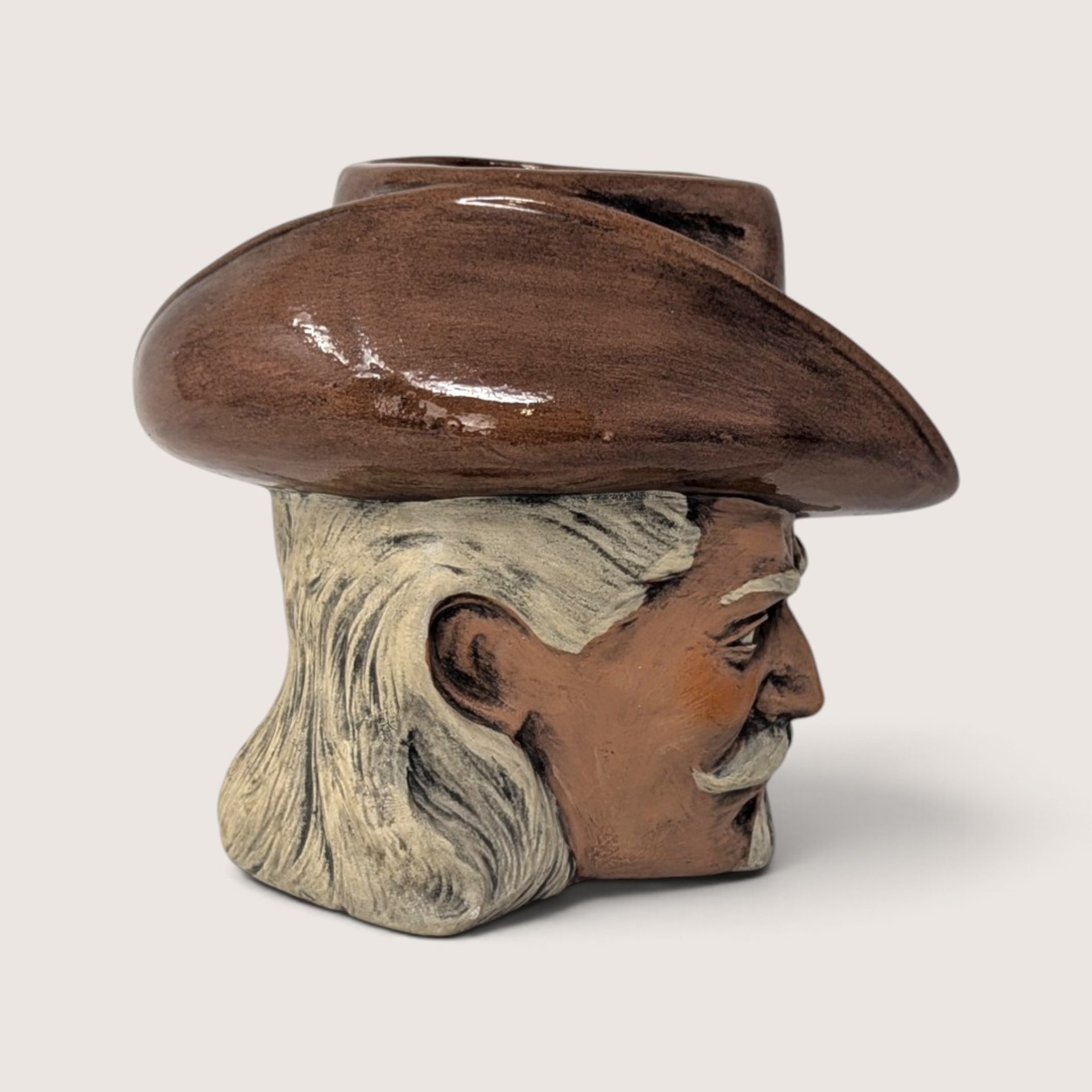 Vintage hand-painted ceramic character mug depicting Buffalo Bill Cody with a sculpted bison handle and "DAD" inscribed on the base.