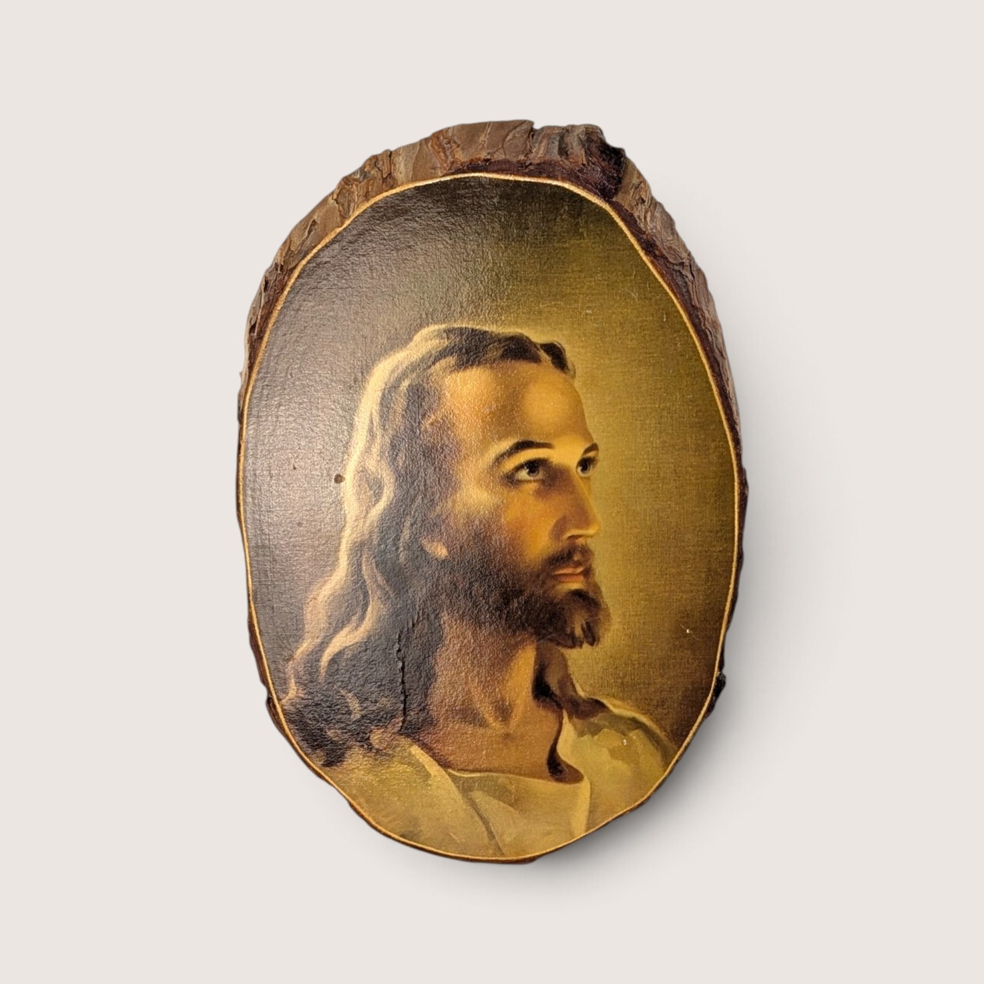 Vintage Warner Sallman Head of Christ reproduction portrait mounted on a natural wood slice plaque.