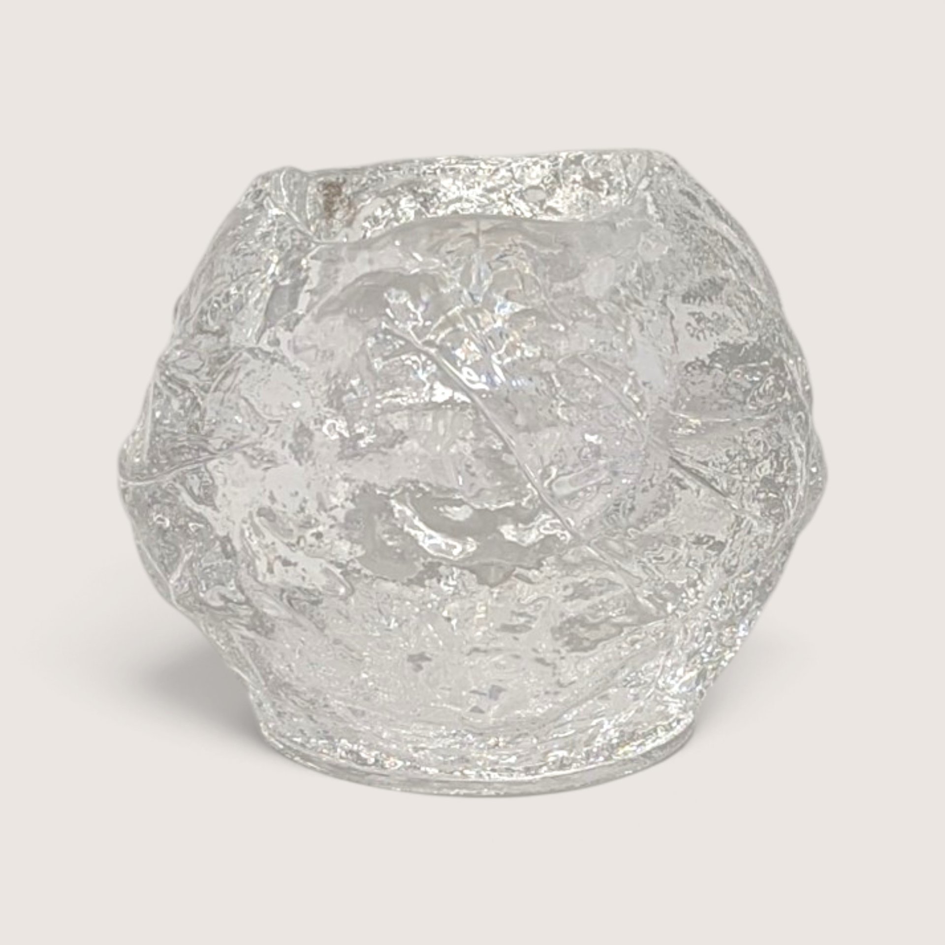 Vintage Kosta Boda Snowball textured art glass votive candle holder next to its original box.