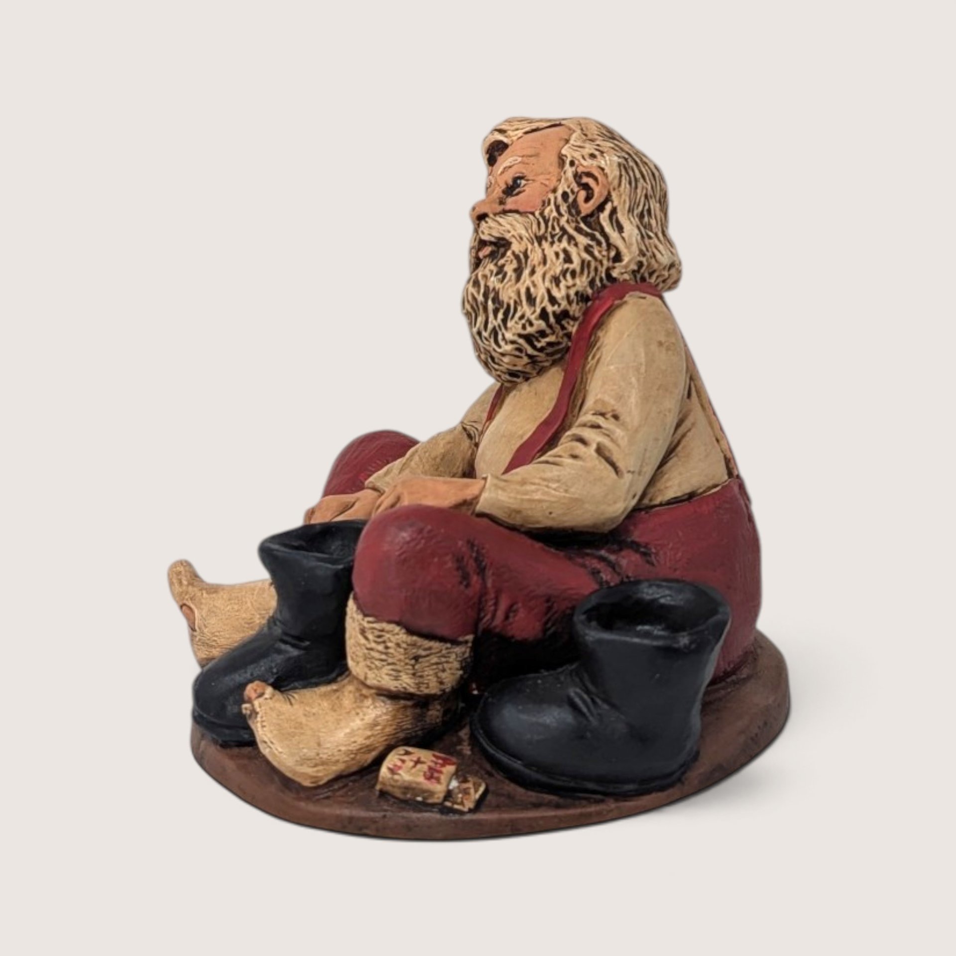 Vintage Santa Putting On Boots Resin Christmas Figurine