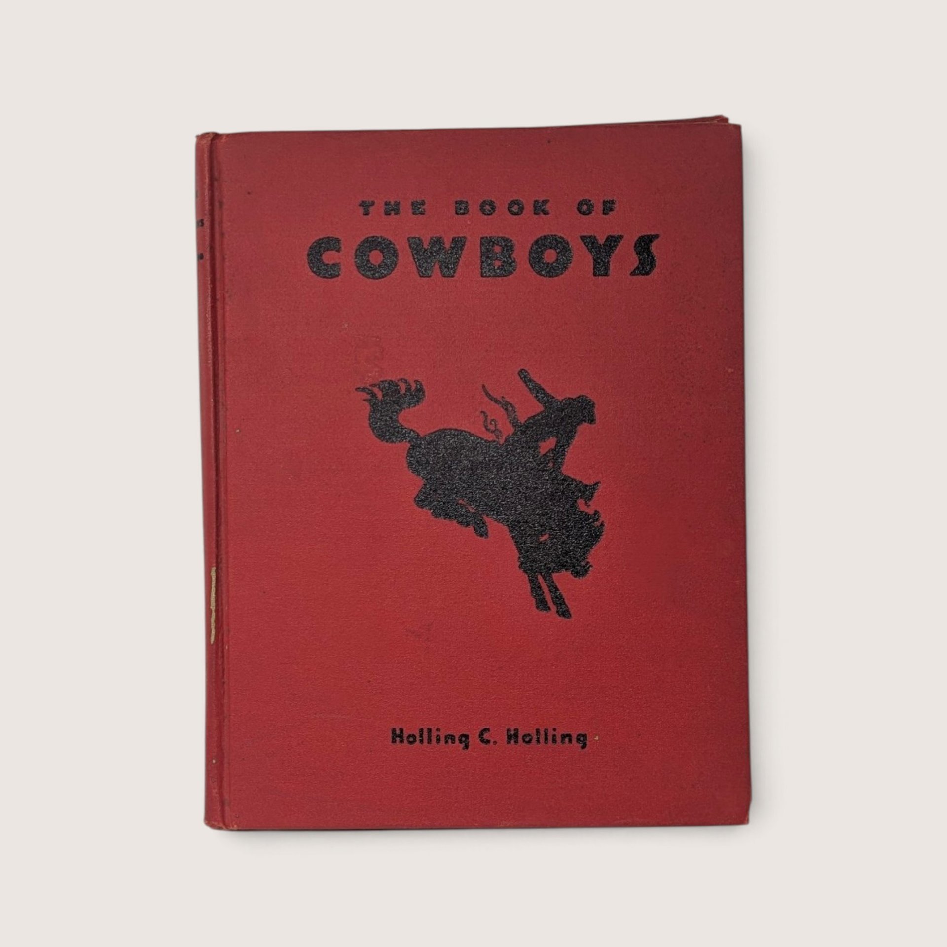 Vintage 1936 hardcover book titled The Book of Cowboys by Holling C. Holling with red cover and cowboy illustration.