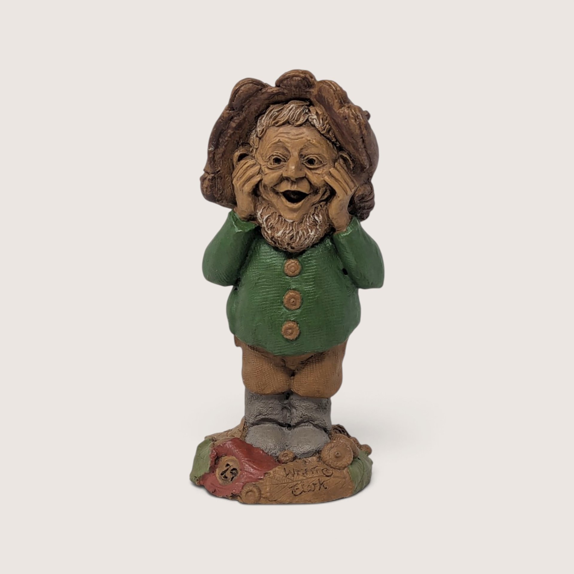 A vintage Tom Clark signed "What" resin gnome figurine from Cairn Studio, standing in a green jacket with a surprised expression.