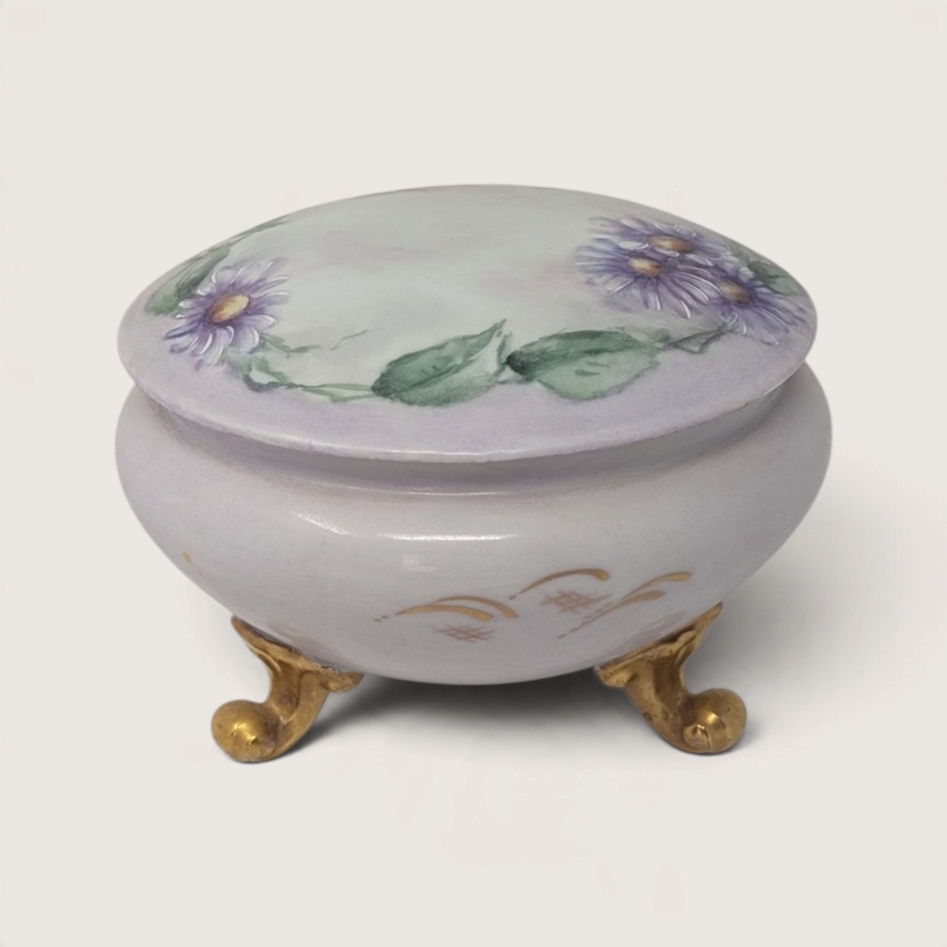 Antique O&EG Royal Austria footed porcelain trinket powder jar hand-painted with purple flowers on a white background.   
