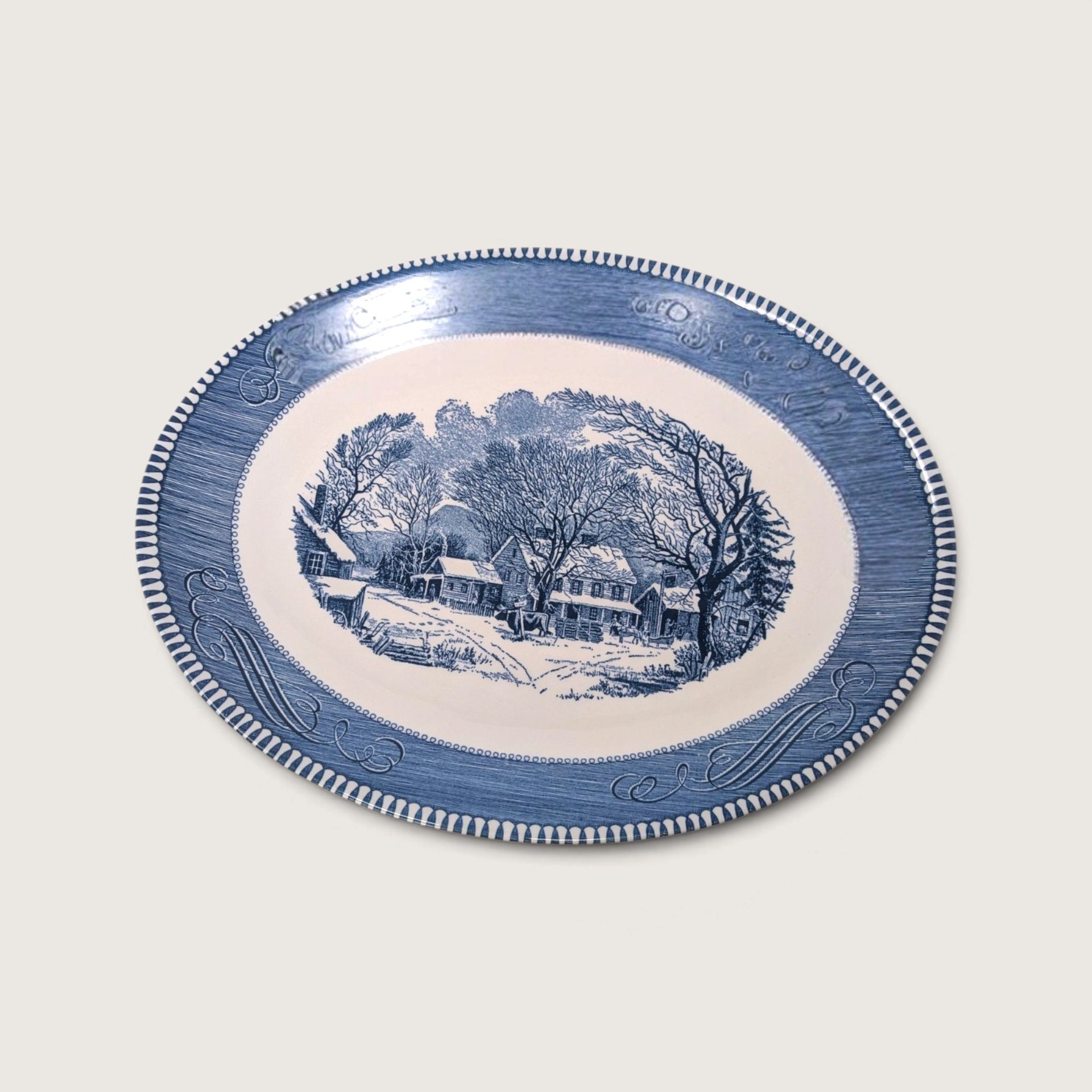Vintage Royal China Currier and Ives blue transferware oval serving platter depicting Old Inn Winter scene on white backdrop.   