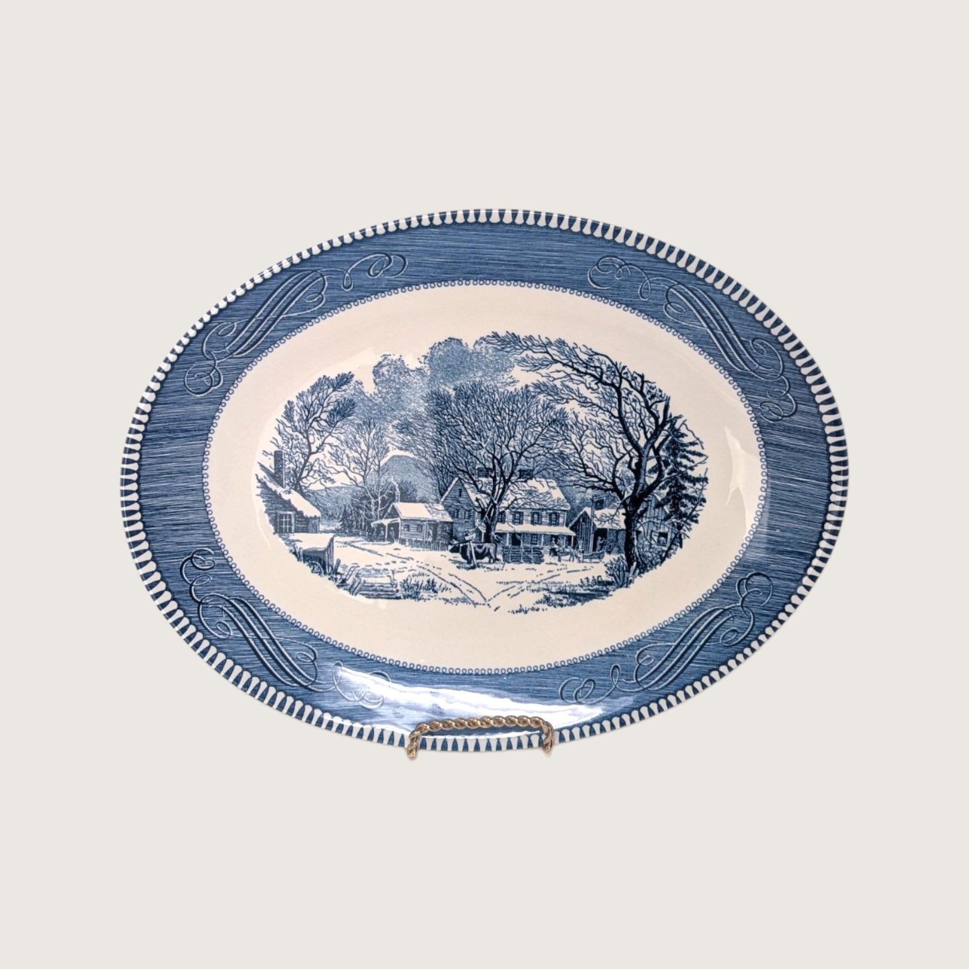 Vintage Royal China Currier and Ives blue transferware oval serving platter depicting Old Inn Winter scene on white backdrop.   