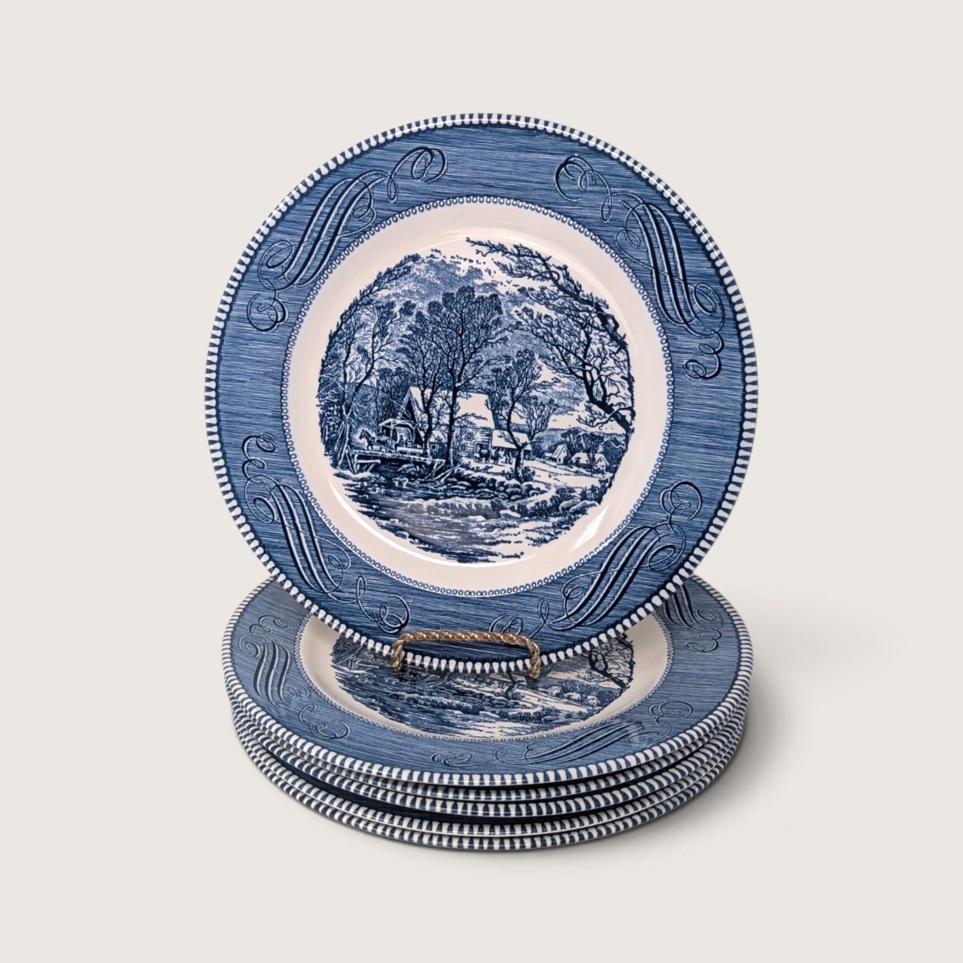 Set of 6 vintage Royal China Currier and Ives blue transferware 10-inch dinner plates stacked showing The Old Grist Mill on white backdrop.