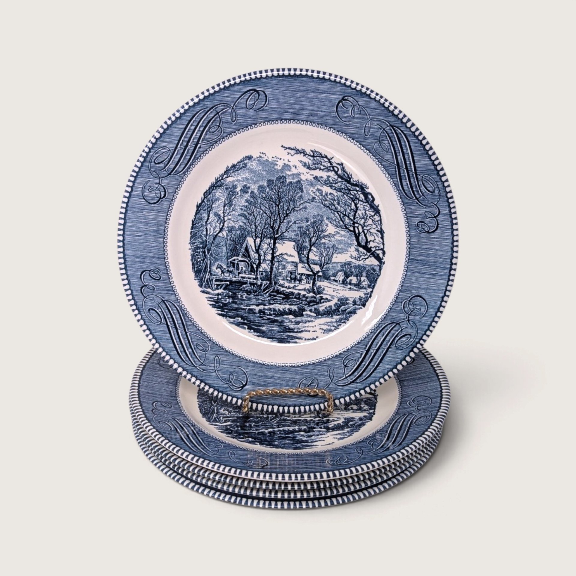 Set of 5 vintage Royal China Currier and Ives blue transferware 10-inch dinner plates stacked showing The Old Grist Mill on white backdrop.   