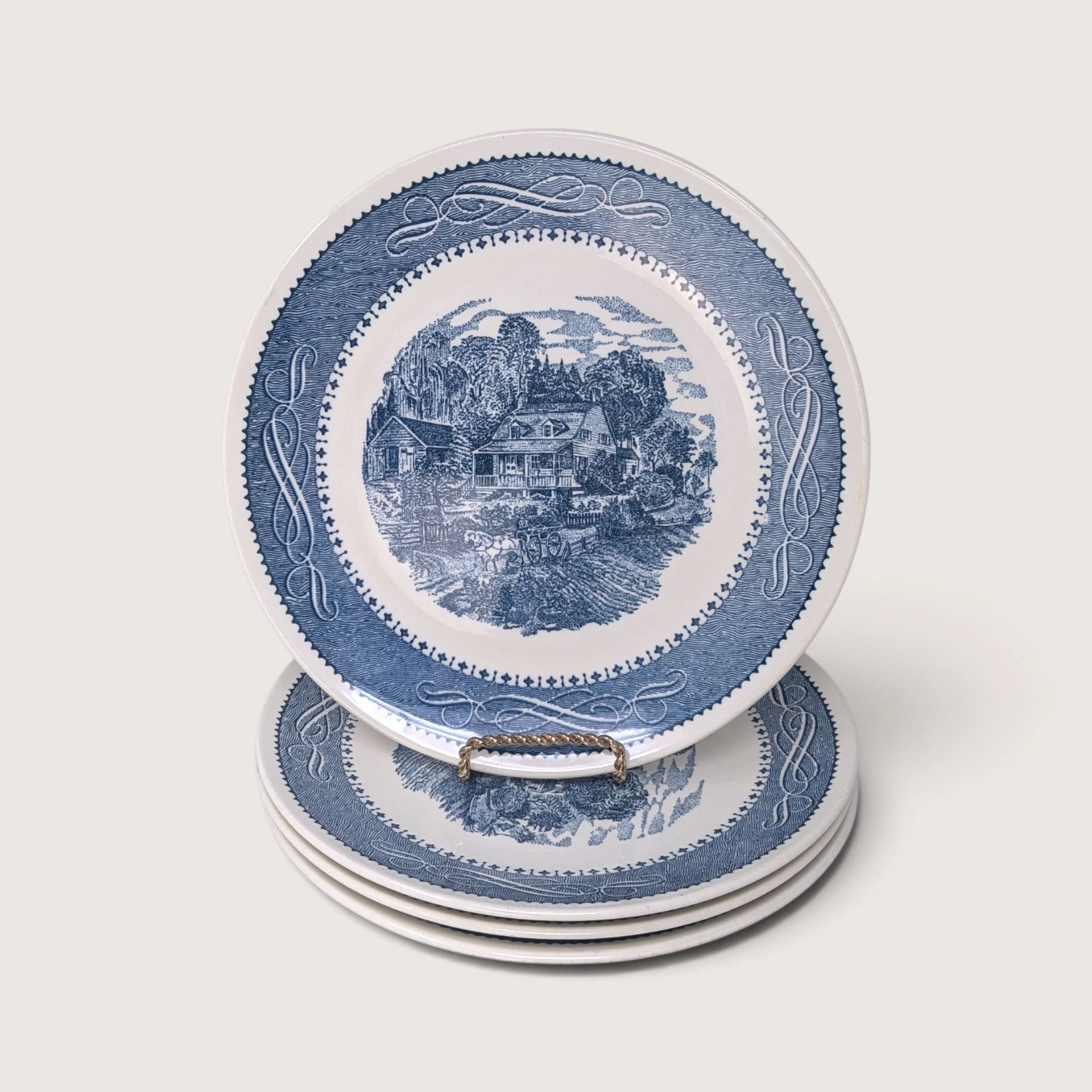 Vintage set of four Currier and Ives blue and white transferware dinner plates depicting The Old Grist Mill scene.   