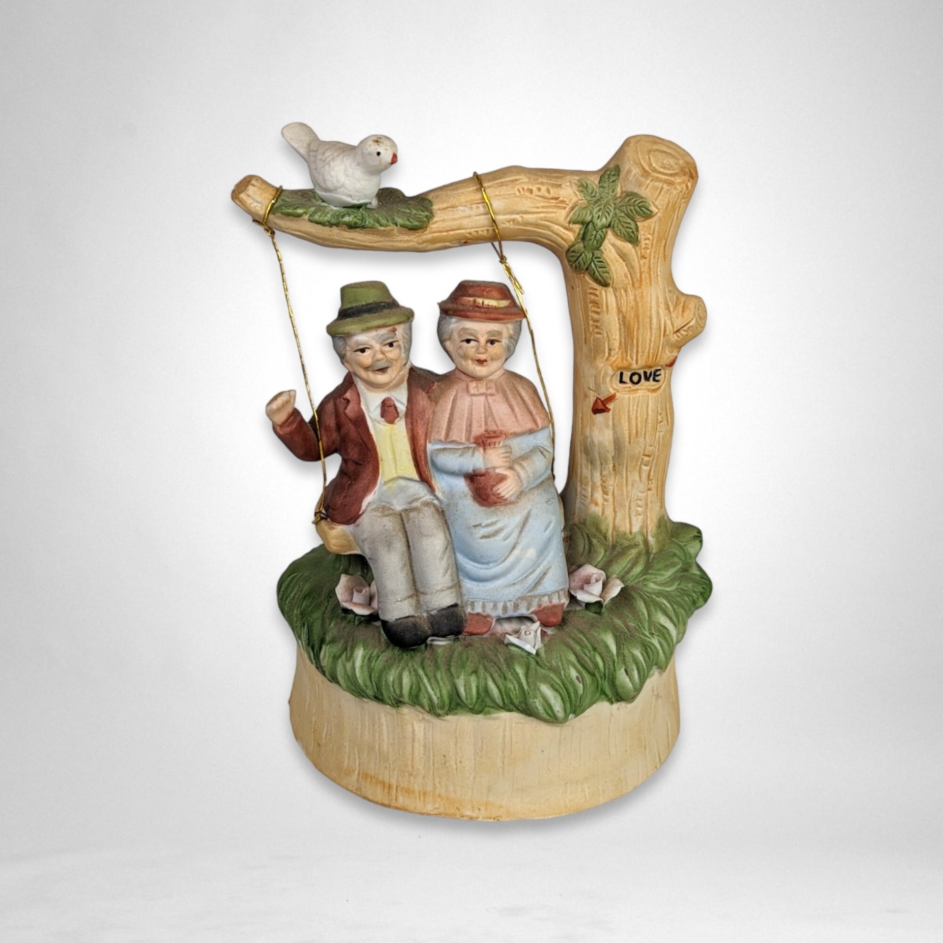 Artmark Ceramic Swinging Older Couple Music Box - Sentimental Melodies of Togetherness