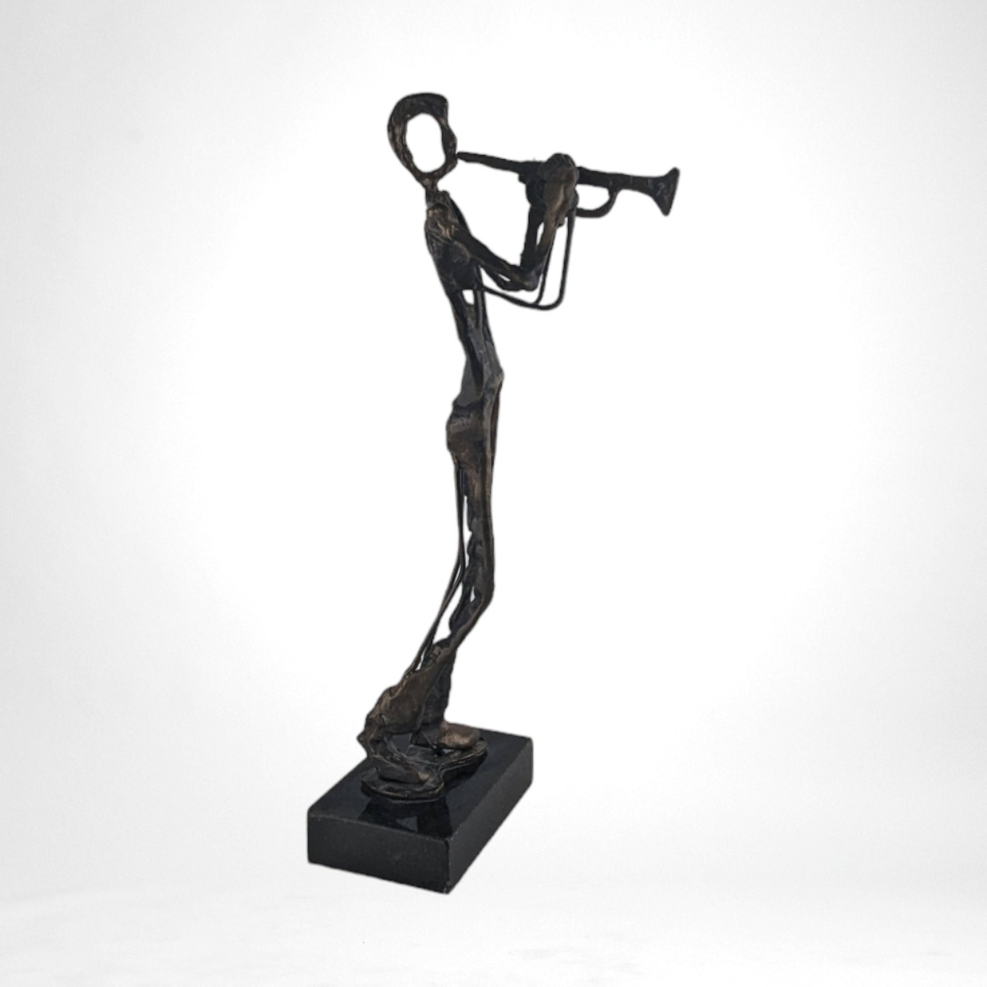 Swingin' Statue: Bronze Horn Player Blows Away in Vintage Charm