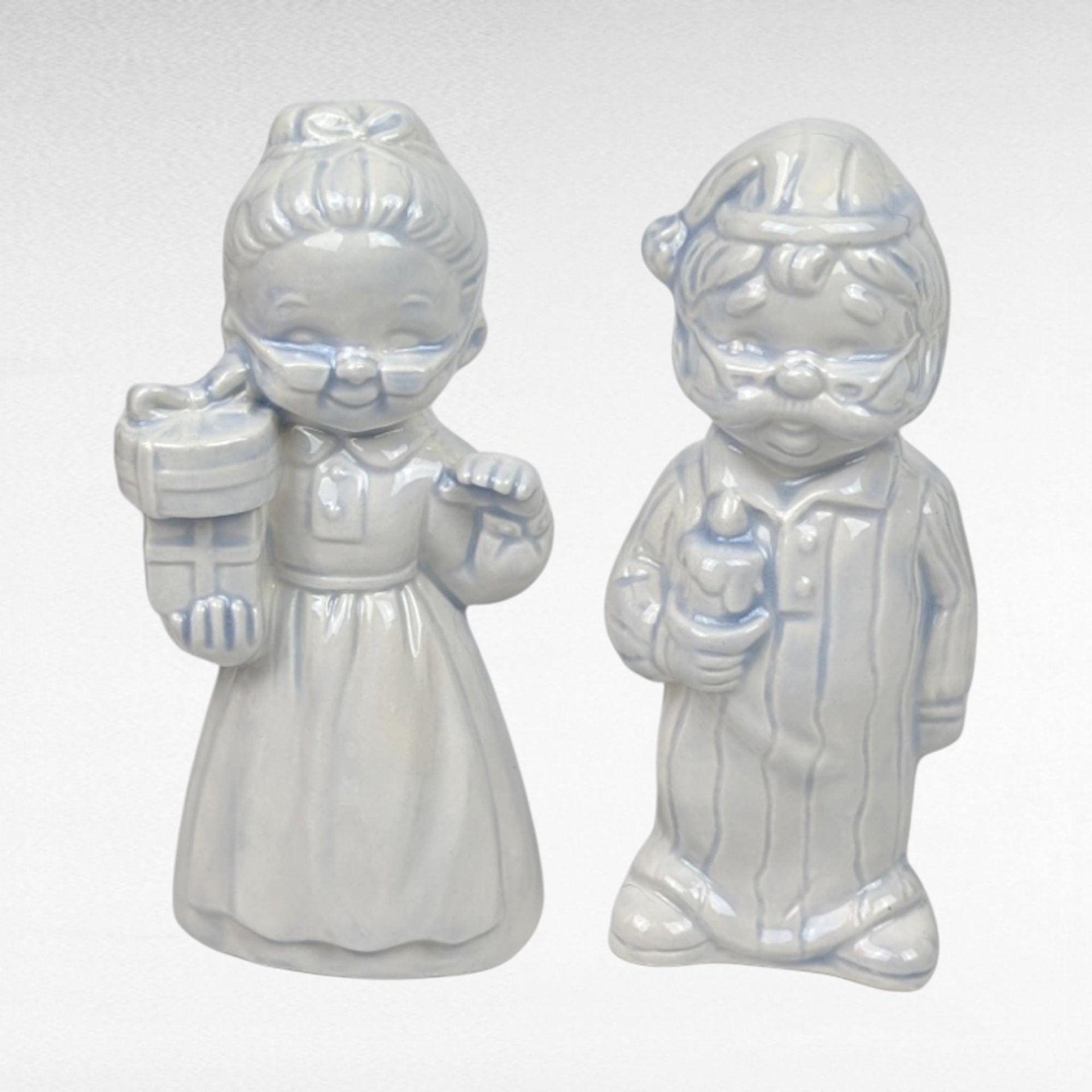 Pair of Ceramic Male and Female Hand Painted Christmas Figurines. 