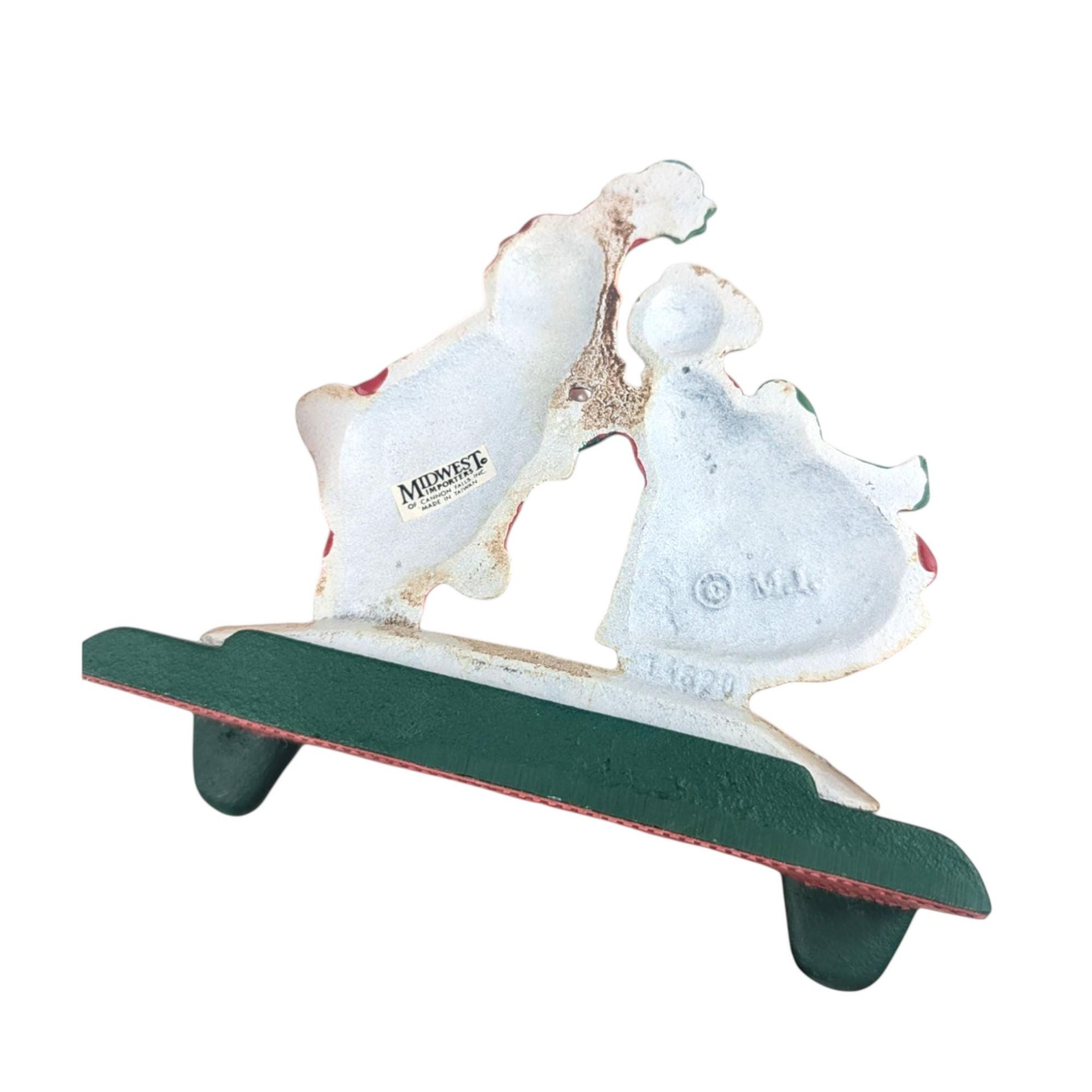 Vintage Kissing Santa Stocking Holder: Cast Iron Christmas Mantle Hanger