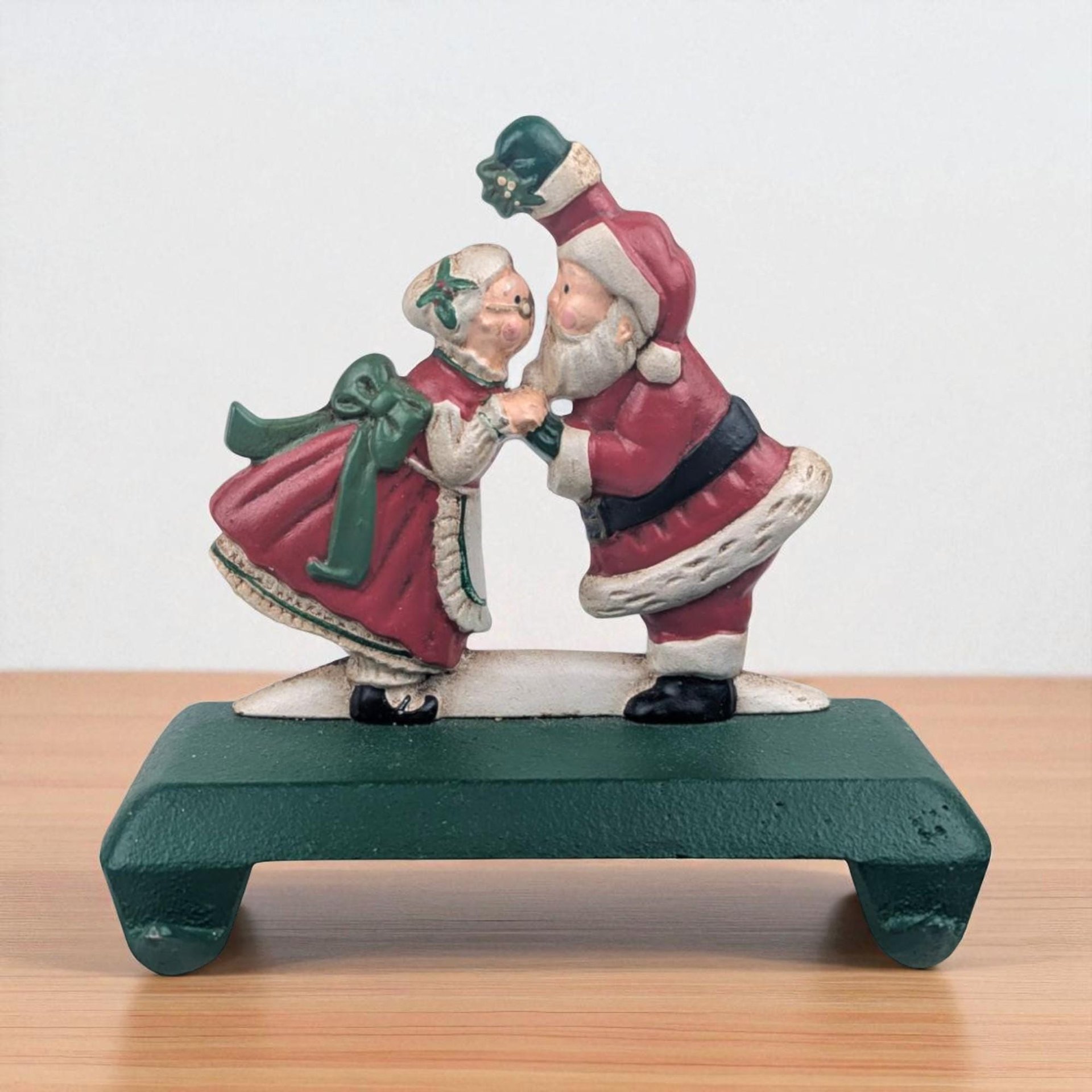 Vintage Kissing Santa Stocking Holder: Cast Iron Christmas Mantle Hanger