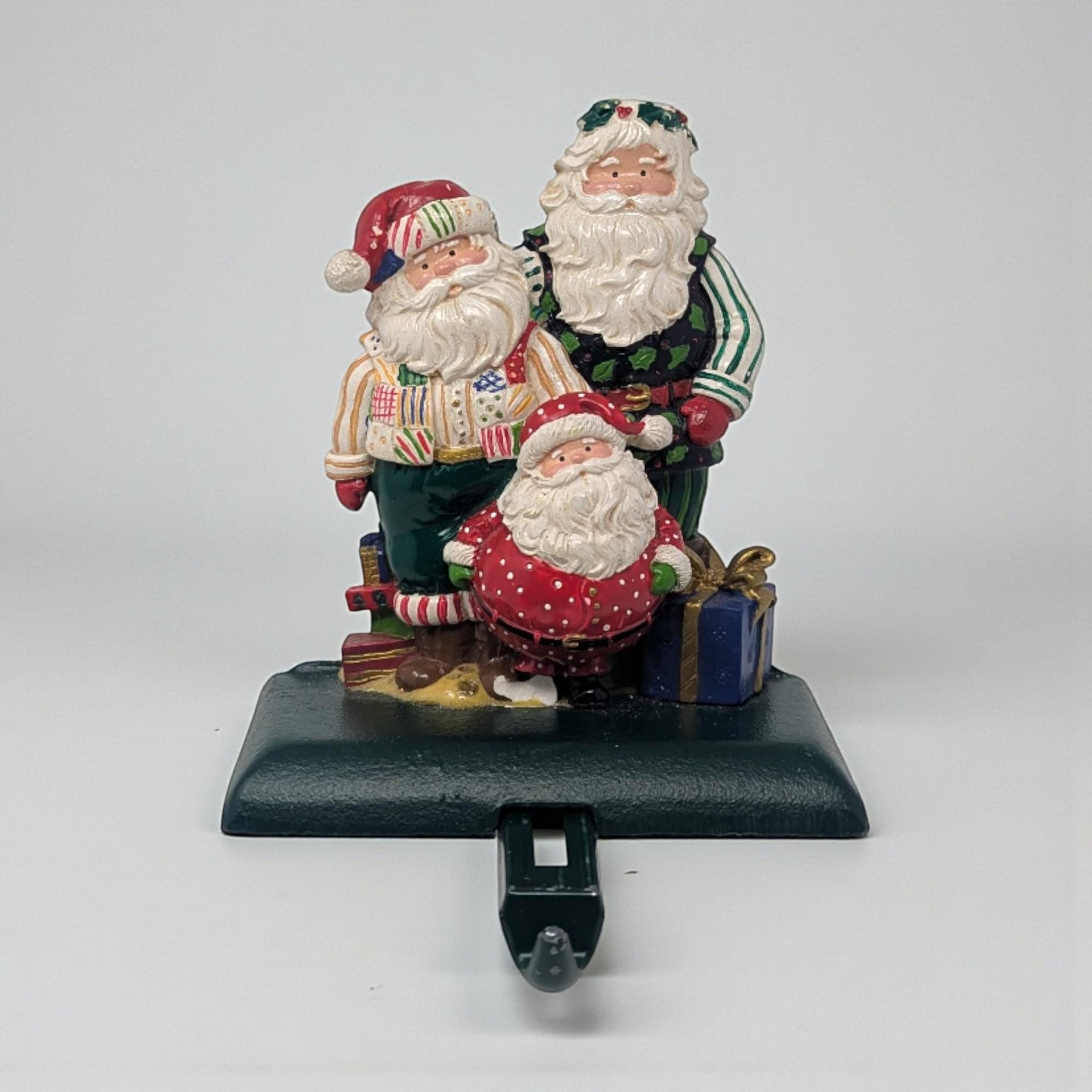 Vintage Resin Cast Iron Stocking Holder: Whimsical Trio of Santas