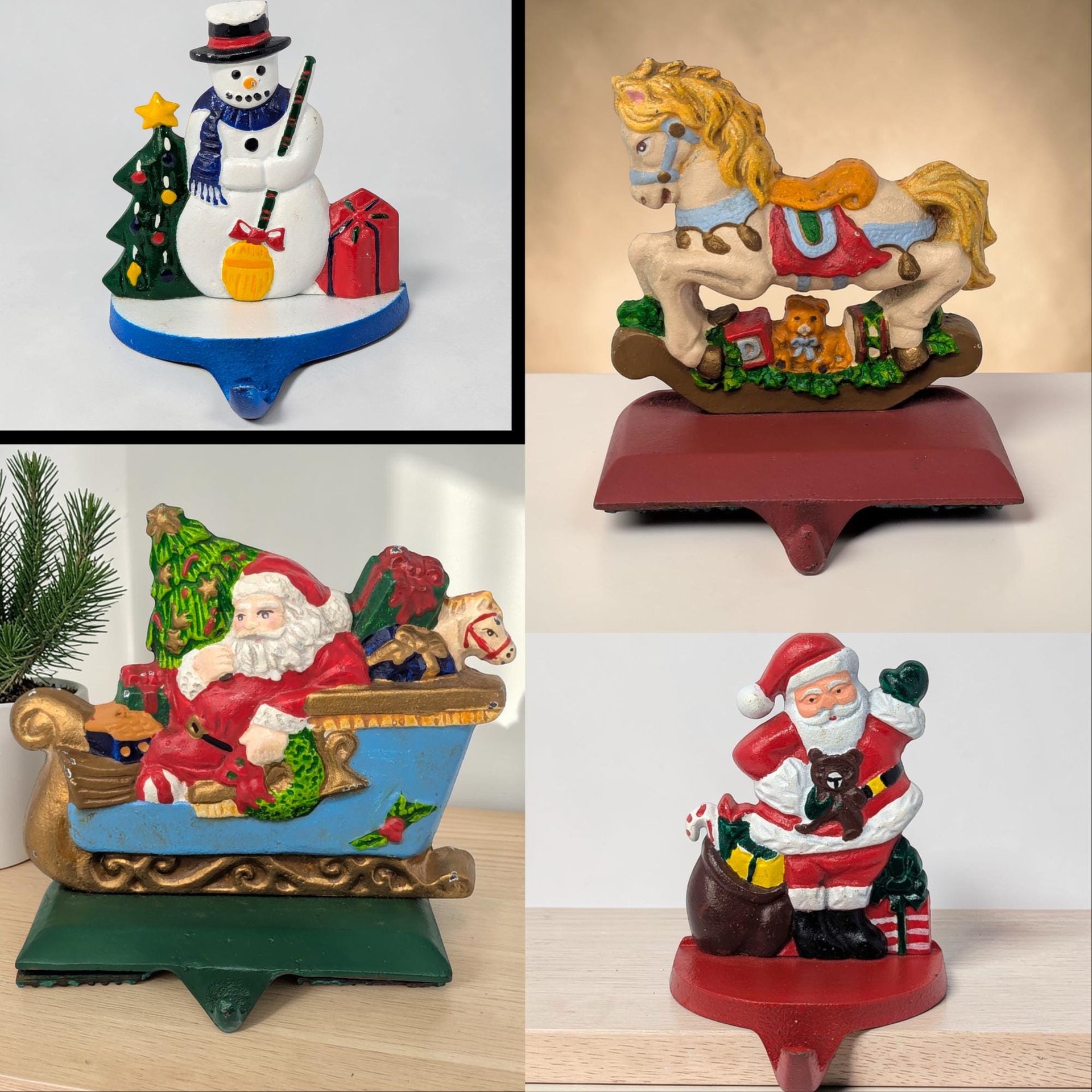 Four heavy cast iron stocking holders featuring hand-painted holiday figures: a standing Santa, Santa in a sleigh, a snowman with a broom, and a rocking horse. Each sits on a white snowy base with a front-facing metal hook.