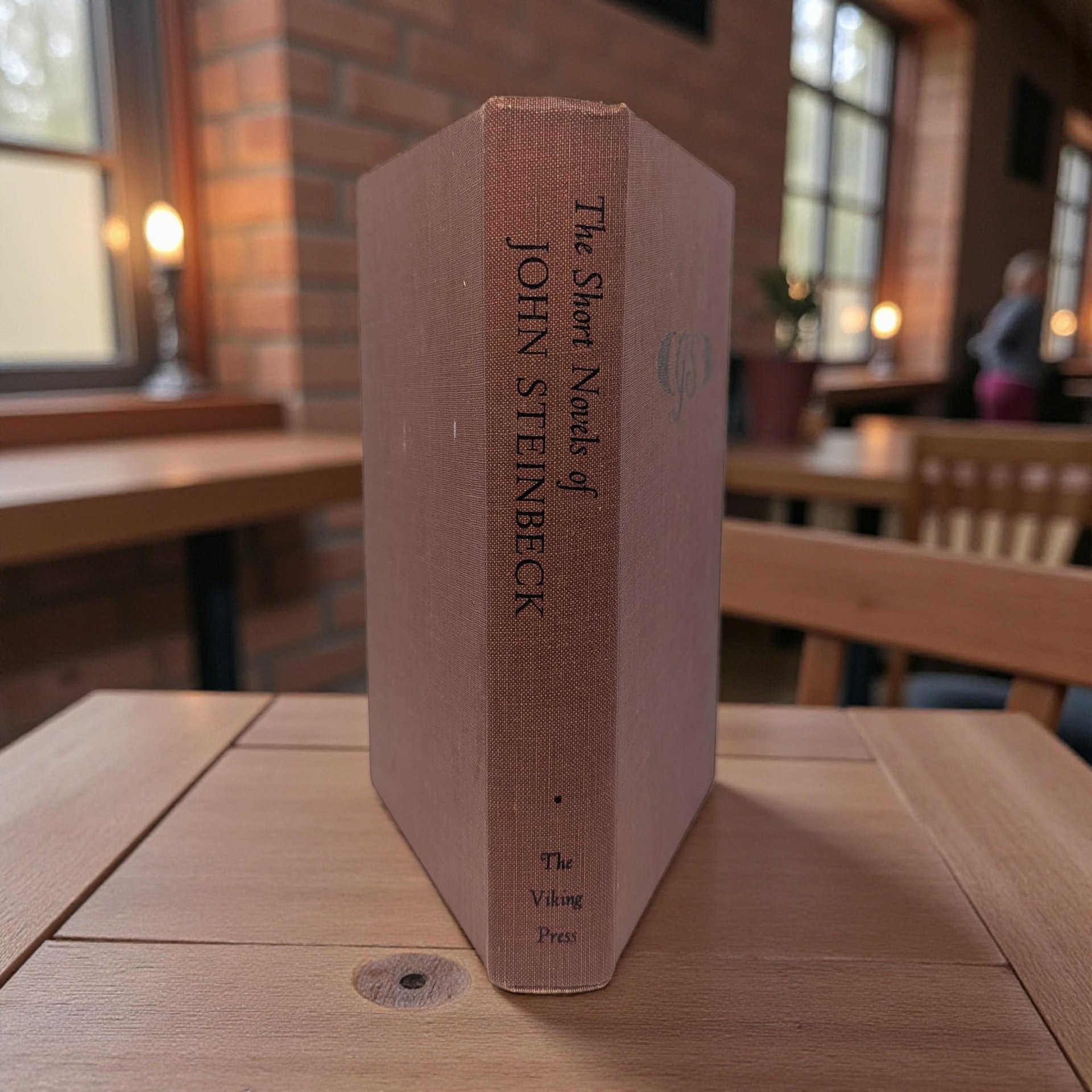 A red clothbound hardcover book with black title lettering on the spine. The cover has a clean, matte texture.