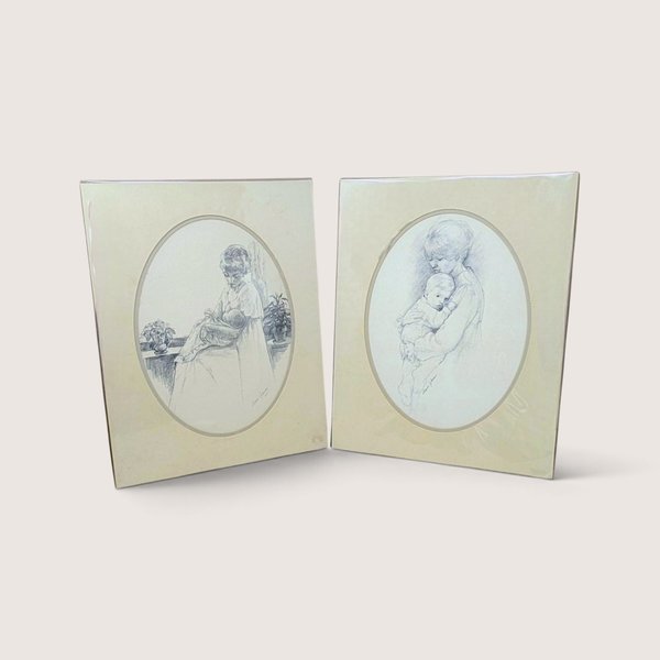 Pair of vintage 1975 Sharon Johnson mother and child pencil sketch art prints in oval mats.