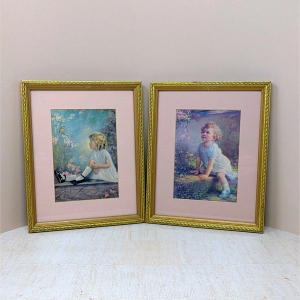 Pair of vintage 1930s framed prints by Zula Kenyon and Florence Lindsey. Features young girls in white dresses interacting with nature. Ornate gold wood frames with pink mats. 10.75 x 8.75 inches.