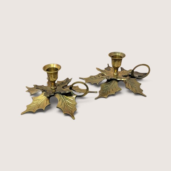 Pair of vintage brass leaf candlestick holders with finger rings made in India.