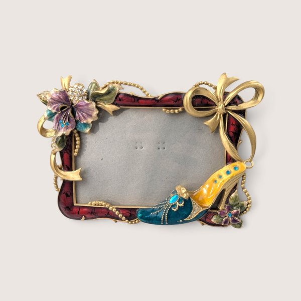 Vintage 2000s enameled metal photo frame with a 3D jeweled high heel shoe, purple flower, and gold bow.