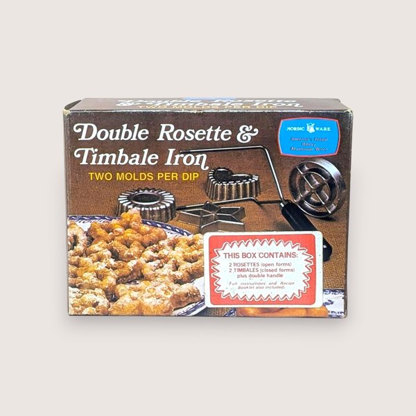 Vintage Nordic Ware Double Rosette and Timbale Iron box showing the product and pastries, isolated on a light background.