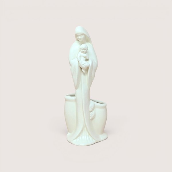 A white ceramic Madonna and Child planter figurine, centered on a beige background.
