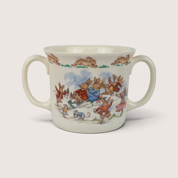 Vintage Royal Doulton Bunnykins fine bone china two-handle mug featuring a sledding motif.