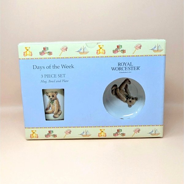A three piece Royal Worcester porcelain nursery set including a plate, bowl, and mug featuring a teddy bear and the Monday's Child poem