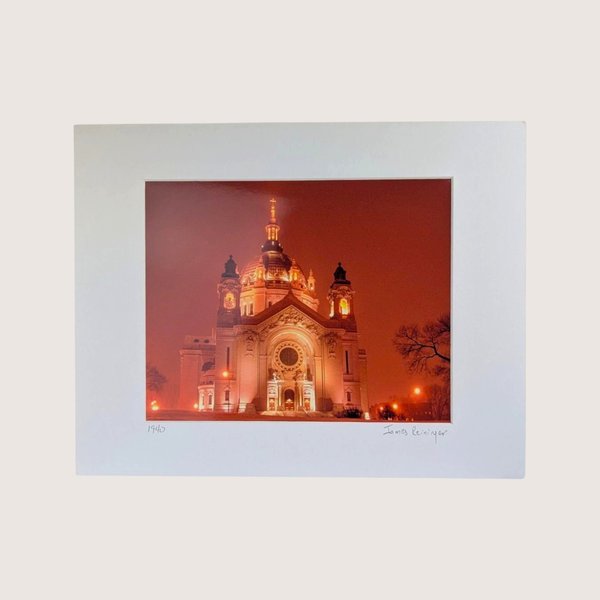 Signed vintage nighttime photography print of the Saint Paul Cathedral in Minnesota matted on a white background.