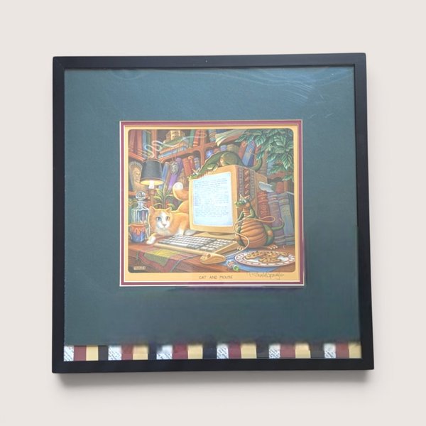 A framed vintage Randal Spangler whimsical print titled Cat and Mouse featuring a calico cat and small dragons at a computer desk.