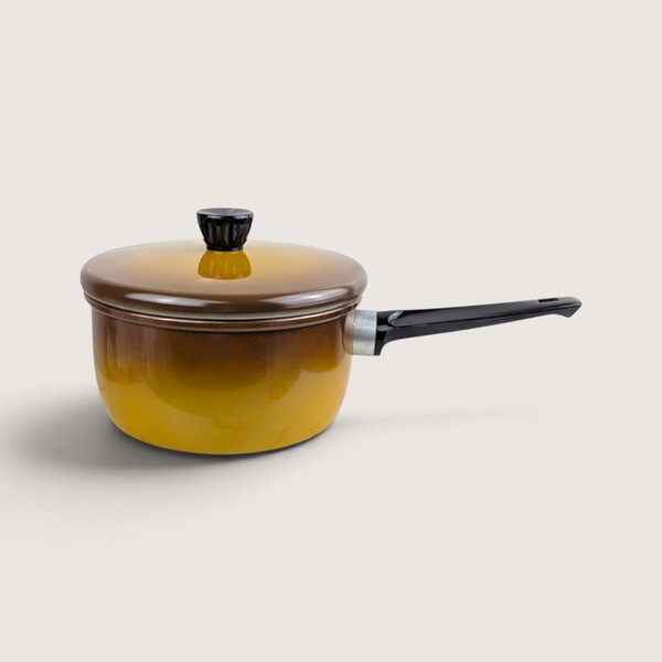 Vintage Revere Ware brown ombre enamel 2 quart sauce pan with lid on a plain light background.