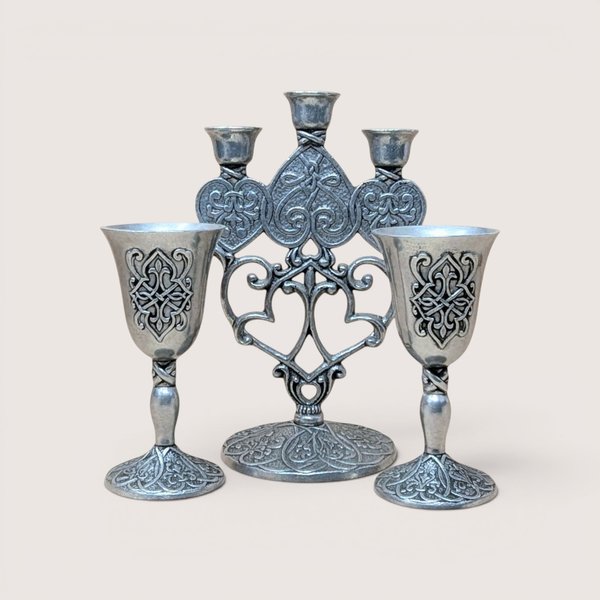 Vintage Carlson Forevermore pewter set consisting of an ornate multi-candle candelabra flanked by two matching goblets with intricate relief patterns.