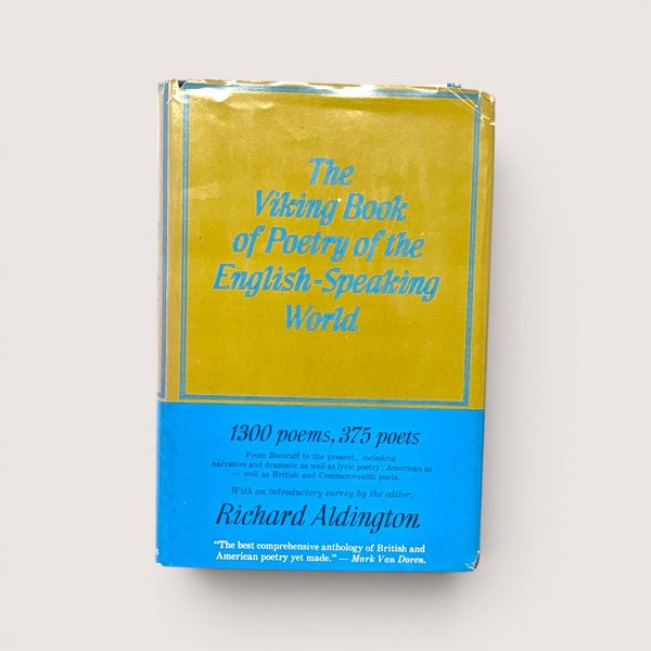The vintage yellow and blue dust jacket of The Viking Book of Poetry anthology on a linen background