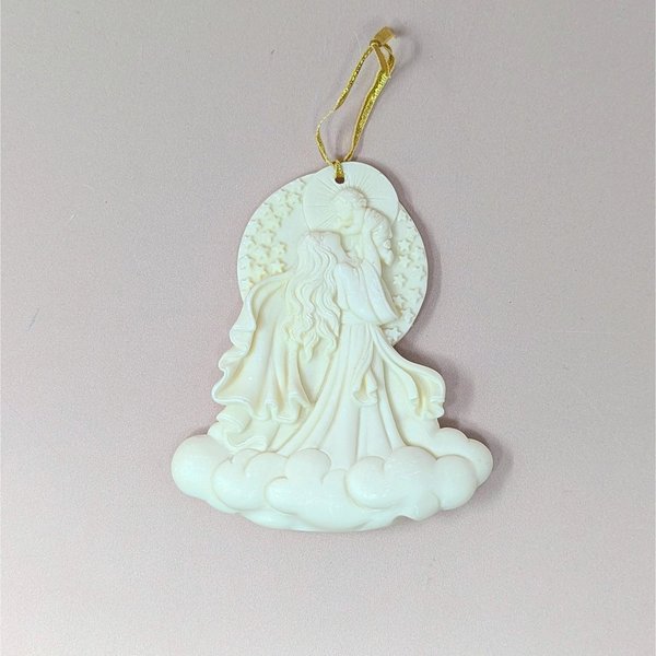 A 2000 Roman Inc "Cause of Our Joy" Millennium Series ornament on a soft pink background. The cream-colored resin cameo style sculpture depicts a flowing Madonna figure raising the infant Christ child into the sky above a base of billowy clouds.