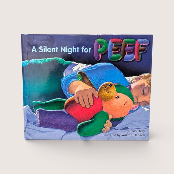 A vintage children book cover showing a child sleeping in bed while cuddling a colorful patchwork teddy bear
