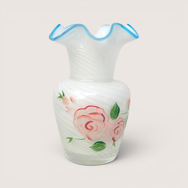 Fenton opalescent white swirl glass vase with hand painted pink roses and a ruffled light blue crest edge.