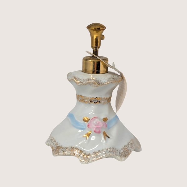Vintage Irice Presto Mist white porcelain dress-shaped perfume bottle atomizer with pink rose, blue bow, and gold accents.