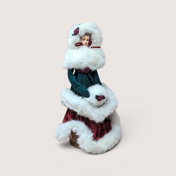 Vintage 1997 Winterthur Christmas tree topper doll in green and burgundy velvet with white faux fur trim.