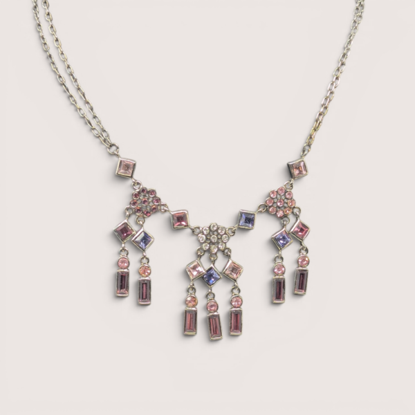 Vintage silver tone multi-color rhinestone chandelier necklace featuring pink and purple crystals.