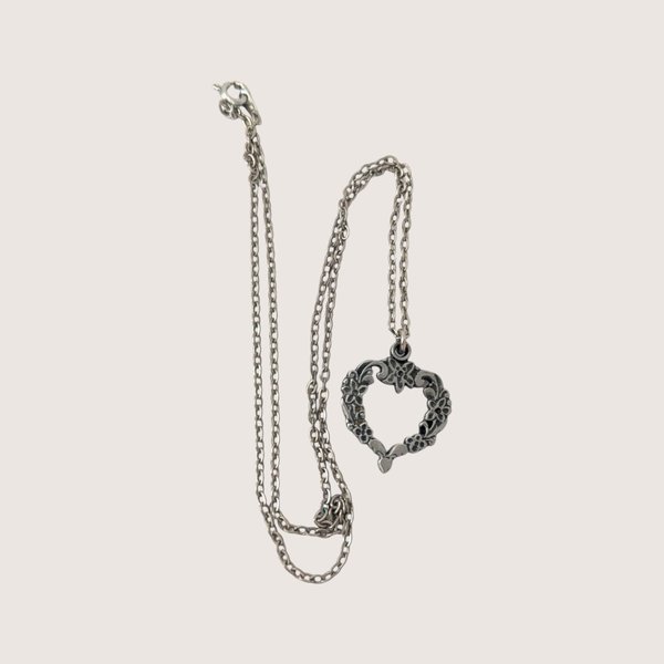 Vintage R. Tennsmed silver pewter heart pendant necklace with floral motifs and a link chain.