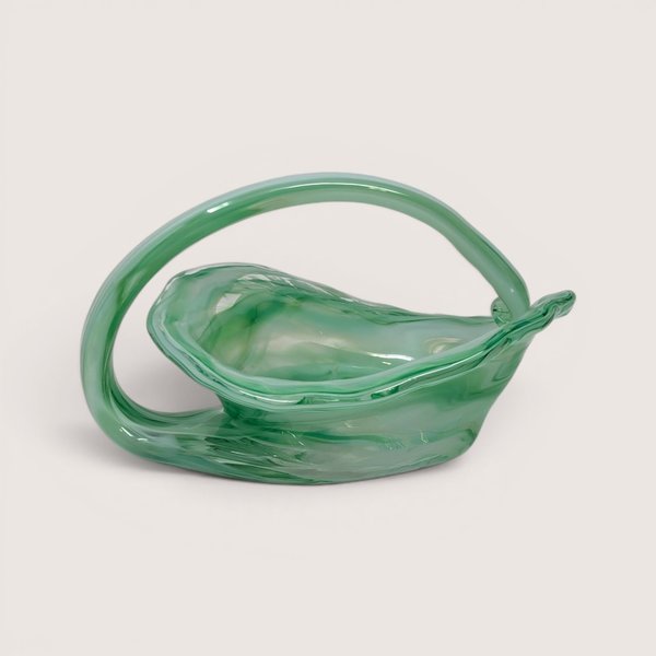 Vintage green art glass basket with a sweeping handle and textured interior.