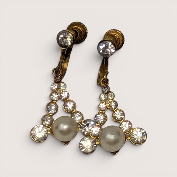Pair of vintage 1950s gold-tone screw-back drop earrings with triangular rhinestone frames and faux pearls.