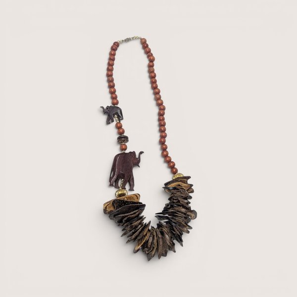 Vintage wooden statement necklace featuring carved wooden elephants and cascading wood chip beads