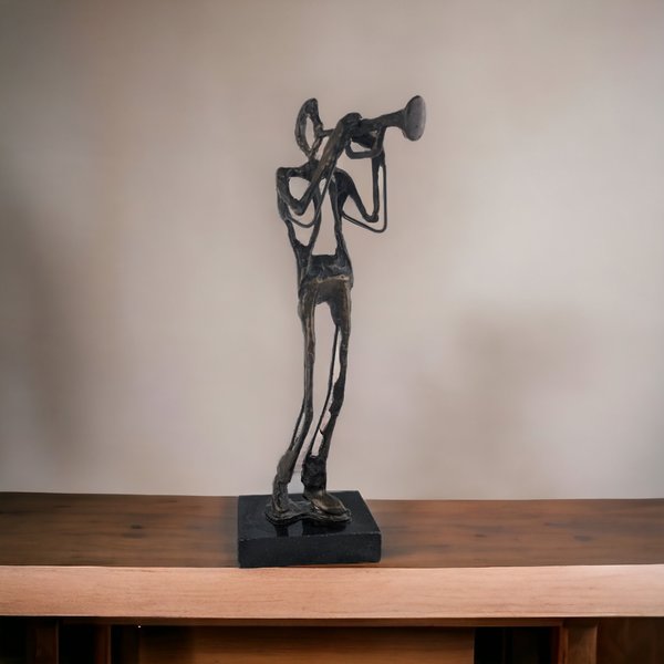 Swingin' Statue: Bronze Horn Player Blows Away in Vintage Charm