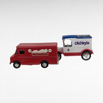 pair of vintage diecast metal banks with an advertising theme,