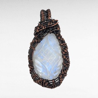 Copper Wire Wrapped Carved Moonstone Pendant. 
