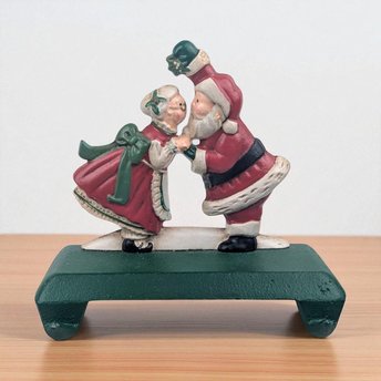 Vintage Kissing Santa Stocking Holder: Cast Iron Christmas Mantle Hanger