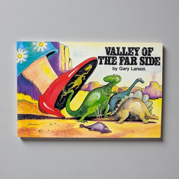 A rectangular softcover cartoon book featuring a vibrant cover illustration of Gary Larson’s signature surreal humor. The glossy cover shows minimal wear, with sharp corners and a clean, flat silhouette.