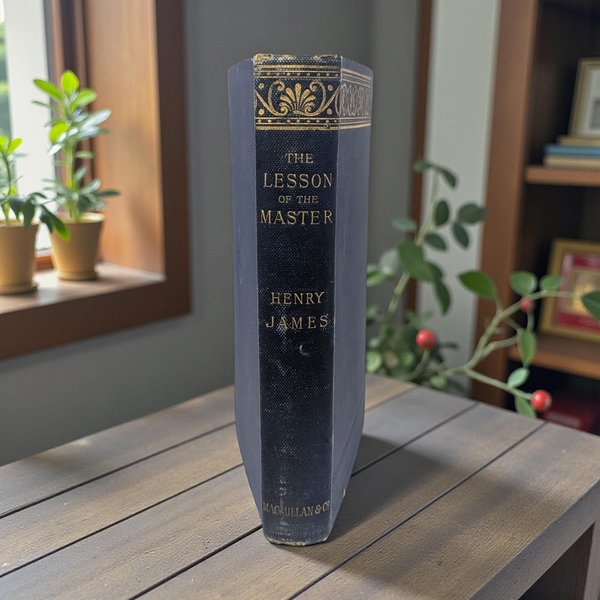A navy blue clothbound hardcover book with a gold gilt title on the spine. The cover features a subtle textured finish and aged edges, showing the classic patina of late nineteenth-century publishing.