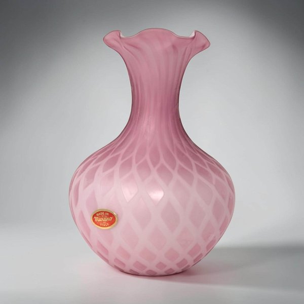 A heavy glass vase in a soft blush pink hue. The exterior is covered in a raised diamond quilling or quilted texture that creates a grid of pointed facets. It has a thick, translucent rim and a solid, tapered base.